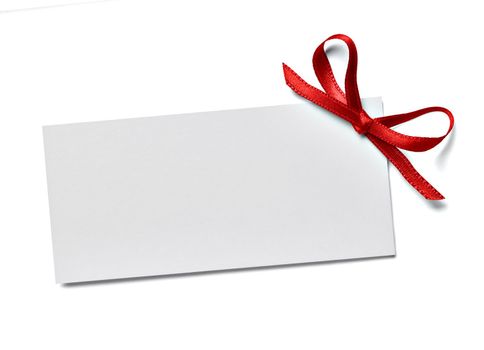 close up of a note card with ribbon bow on white background