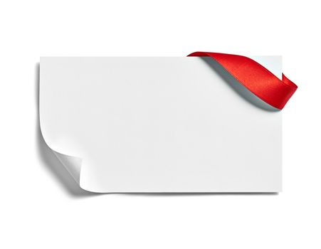 close up of a note card with red ribbon bow on white background