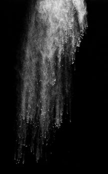 close up of powder or flour on black background