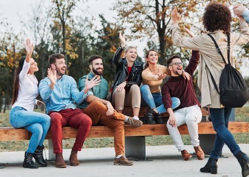 Group of young people having fun outdoors in a park