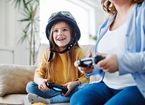 mother and daughter playing and having fun at home