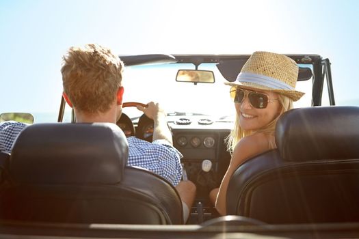 Car travel, road trip and back portrait of couple on bonding holiday adventure, transportation journey or fun summer vacation. Love flare, convertible vehicle or driver driving in Ukraine countryside.