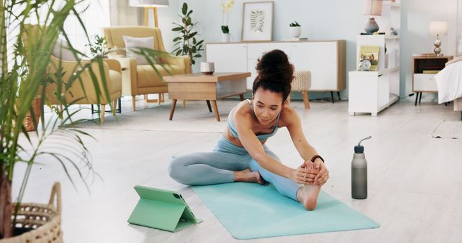 Fitness, yoga or meditation stretching woman for workout in the living room of her house. Girl with chakra focus, mindset or balance while training, exercise or health with zen pilates for wellness