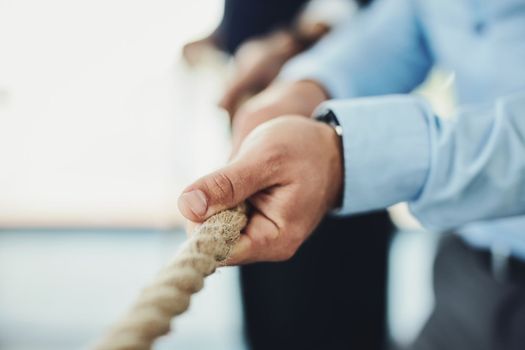 Grab a hold of your goals and keep pulling them closer. Closeup shot of unrecognizable businesspeople pulling on a rope