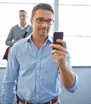 Smile, travel or business man with phone in airport for invest strategy, finance growth or financial review. CEO or corporate manager on smartphone planning, data analysis or economy data research.