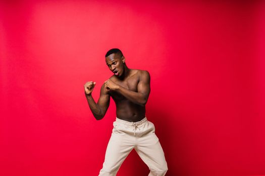 Like what you see. A handsome and muscular young man posing in studio.