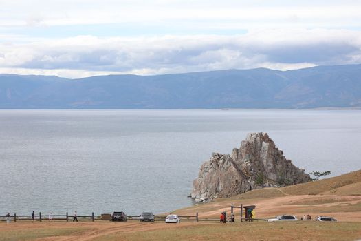 View from the observation deck of the Shaman Stone against the blue sky and Lake Baikal on Olkhon Island