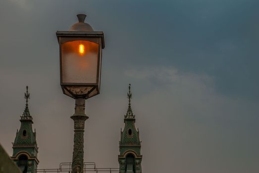 Lamp on the Hammersmith Bridge in west London. The first suspension bridge over the River Thames from Hammersmith to Barnes