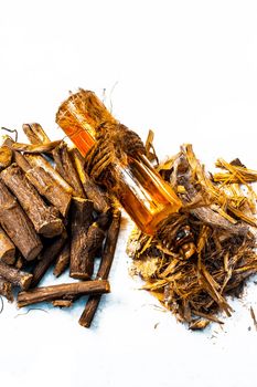 Ayurvedic herb Liquorice root, Licorice root, Mulethi or Glycyrrhiza glabra root and its powder with its oil for detoxifying the body, soothing spasms, easing menstrual cramps, raising blood pressure.