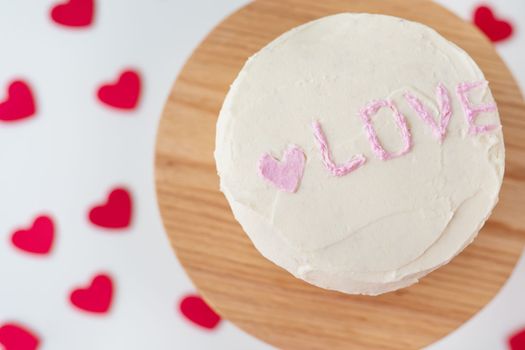 Bento cake with the inscription Love and hearts. A small Korean cake for one person. A cute dessert gift for a loved one for any holiday. Valentine's Day