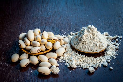 Ayurvedic herb kuanch, cowhage, Mucuna pruriens with powder in a brown plate with its powder, and raw kuanch for premature ejaculation, erectile dysfunction, and other sperm-related diseases.