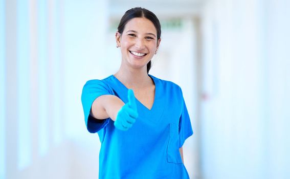 Spreading positivity everywhere she goes. a young beautiful dental assistant giving the thumbs up