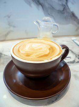 Texture surface of soft and delicate milk froth in a cup of coffee