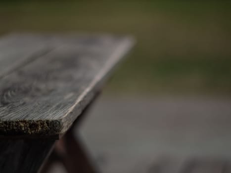 The shabby patio wooden furniture in the garden