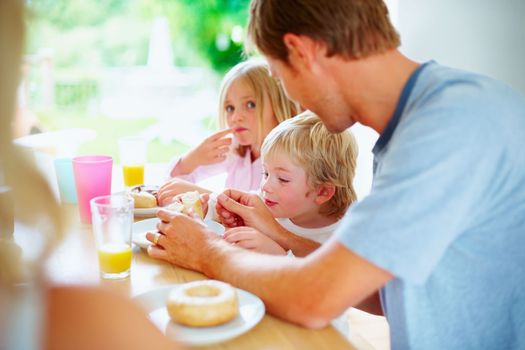 Family having their breakfast together. Portrait of family having their breakfast together