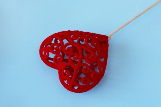 red heart on a stick. Valentine's Day concept. Copy space.