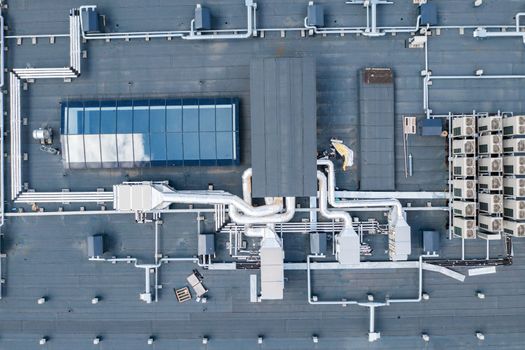 air ventilation flow system on the roof of the building. vent pipe fan HVAC.