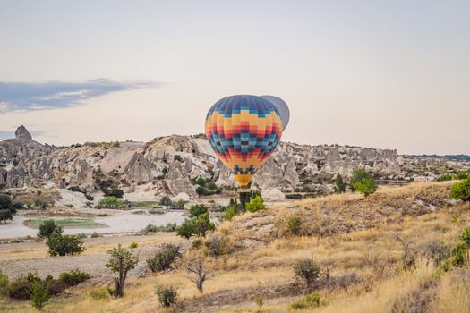 Colorful hot air balloon flying over Cappadocia, Turkey.