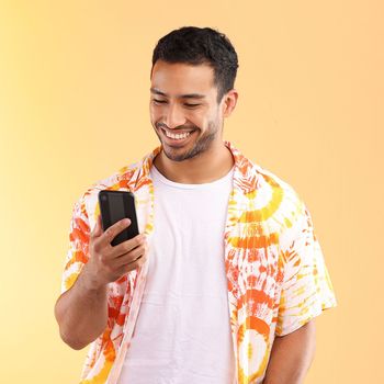 Man with smartphone in hand, smile and happy with chat or social media, communication isolated on studio background. Technology, happiness and funny meme, phone with internet wifi and mockup.