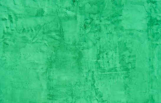 Green concrete wall with physical damage to the plaster. Place for text. Copy space.