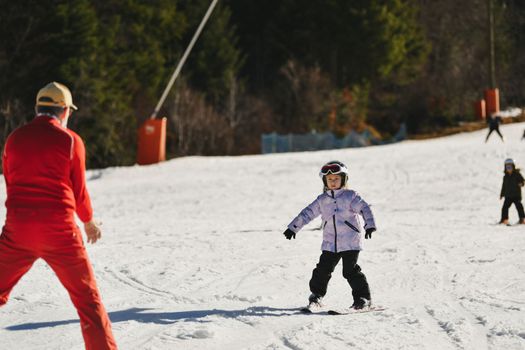 Ski coach giving a lesson on how to ski