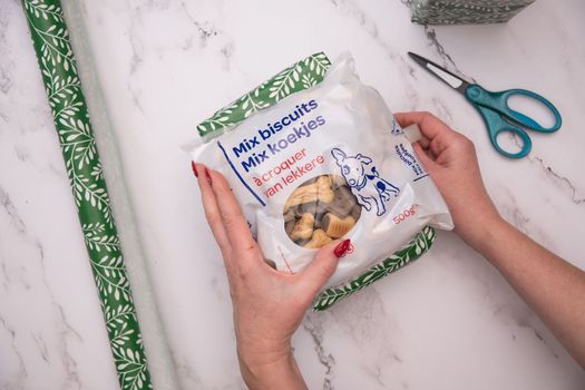 wrapped in a beautiful festive package gift for a pet delicious treats, High quality photo
