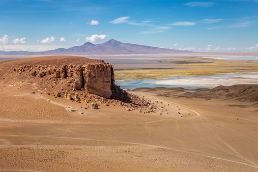 Salt lake reflection and idyllic volcanic landscape at Sunset, Atacama desert, Chile border with Bolivia