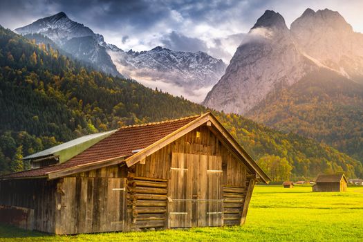 Bavarian alps and rustic farm barns, Garmisch Partenkirchen, Zugspitze massif, Bavaria, Germany