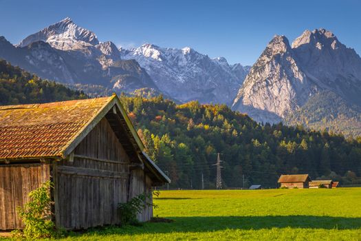 Bavarian alps and rustic farm barns, Garmisch Partenkirchen, Zugspitze massif, Bavaria, Germany