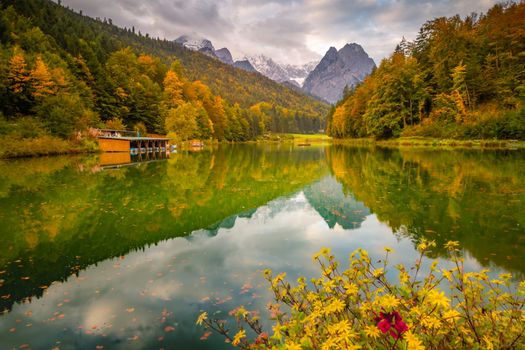 Riessersee alpine turquoise lake reflection at sunrise, Garmisch, Bavarian alps, Germany