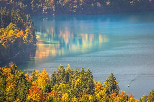Alpsee Lake reflection in Bavarian alps at golden autumn, Karwendel mountains, Bavaria, Germany border with Austria