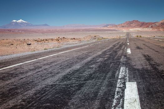 Road in Peaceful Moon Valley dramatic landscape at Sunset, Atacama Desert, Chile