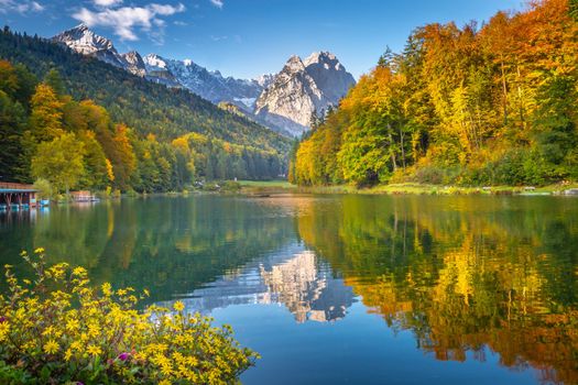 Riessersee alpine turquoise lake reflection at sunrise, Garmisch, Bavarian alps, Germany