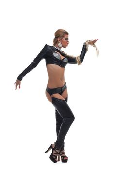 Full length portrait of dancer in bdsm latex costume with braid. Isolated on white