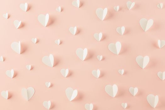 Happy Valentines Day background. Top view flat lay of paper elements cutting white hearts shape flying on pink background, Valentine Love day concept, Banner template design of holiday