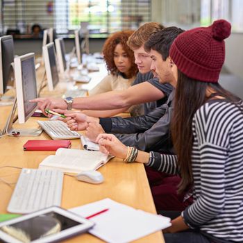 Young minds at work. students working on computers in a university library