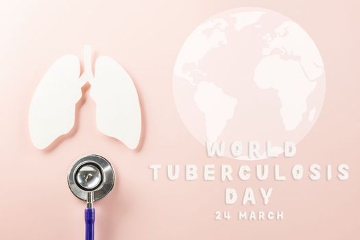 World Tuberculosis Day. Overhead lungs paper symbol and medical stethoscope on pink background, lung cancer awareness, copy space concept of world TB day, banner background, pneumonia awareness