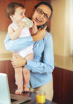 Even supermoms need support sometimes. a busy young mother at home with her baby