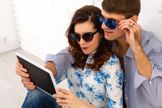 Happy young couple doing shopping on internet