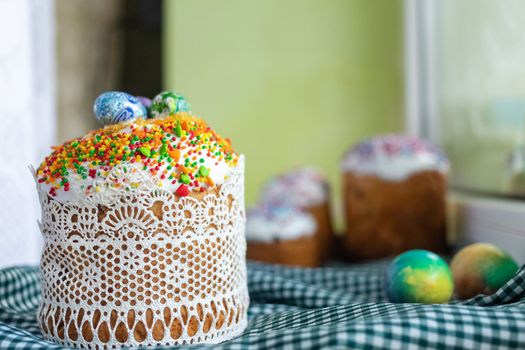 Traditional Easter cake with glace icing and painted easter eggs.Rustic style. Easter arrangement.