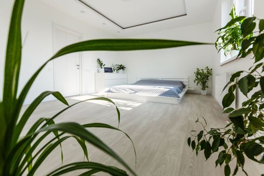 Abstract white waving curtain in white bedroom apartment