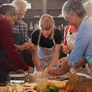 Bake with love. a group of seniors attending a cooking class