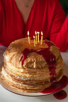Pancakes with berries jam and 5 candles