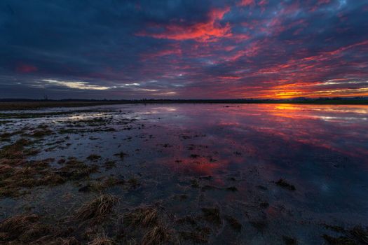 Colorful clouds during sunset over the backwaters, Czulczyce, eastern Poland