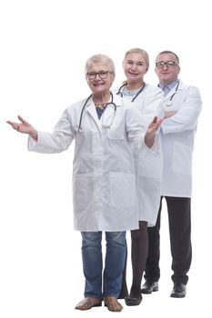 in full growth. a group of successful doctors standing in a row. isolated on a white background