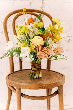 Square wedding ceremony. The round arch is decorated with flowers, greenery. Cute, trendy wedding decor. Part of the festive decor, flower arrangement.