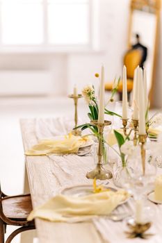 Beautiful Easter table setting with floral decor indoors