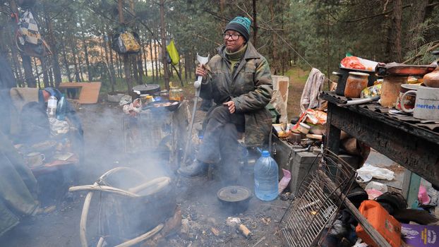 Beggars huts of homeless people near the landfill