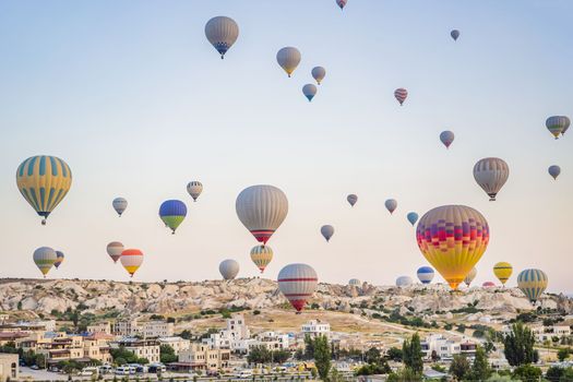 Colorful hot air balloon flying over Cappadocia, Turkey.