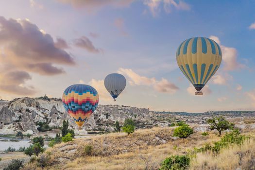 Colorful hot air balloon flying over Cappadocia, Turkey.